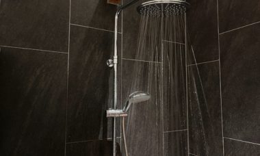 black tile with showerhead