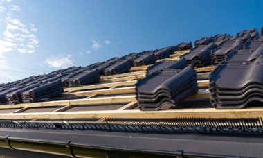 Roof ceramic tile arranged in packets on the roof on roof battens. Preparation for laying roof tiles